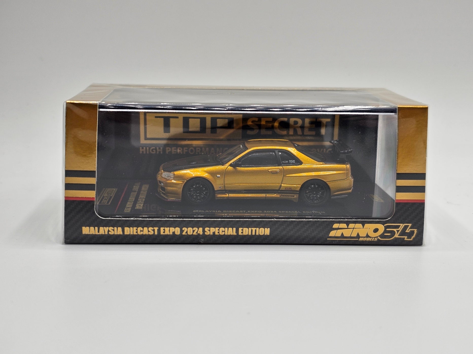 INNO64 Nissan GT-R R34 Gold Top Secret MDX Expo 2024 Tokyo Auto Salon 1:64