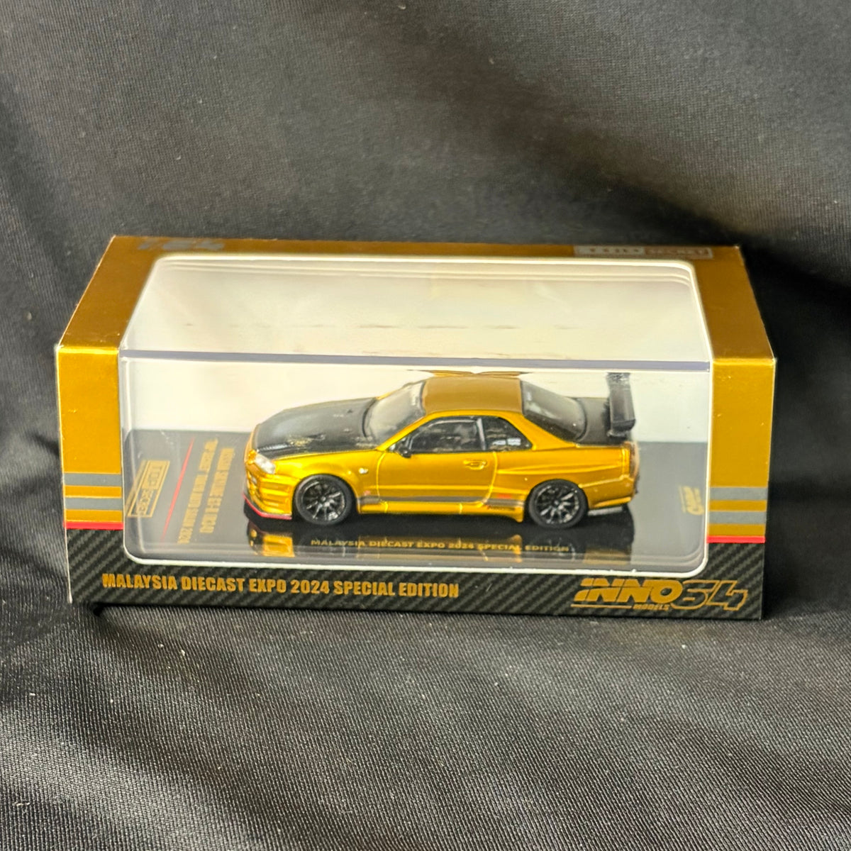 INNO64 Nissan Skyline GT-R R34 Top Secret Gold
