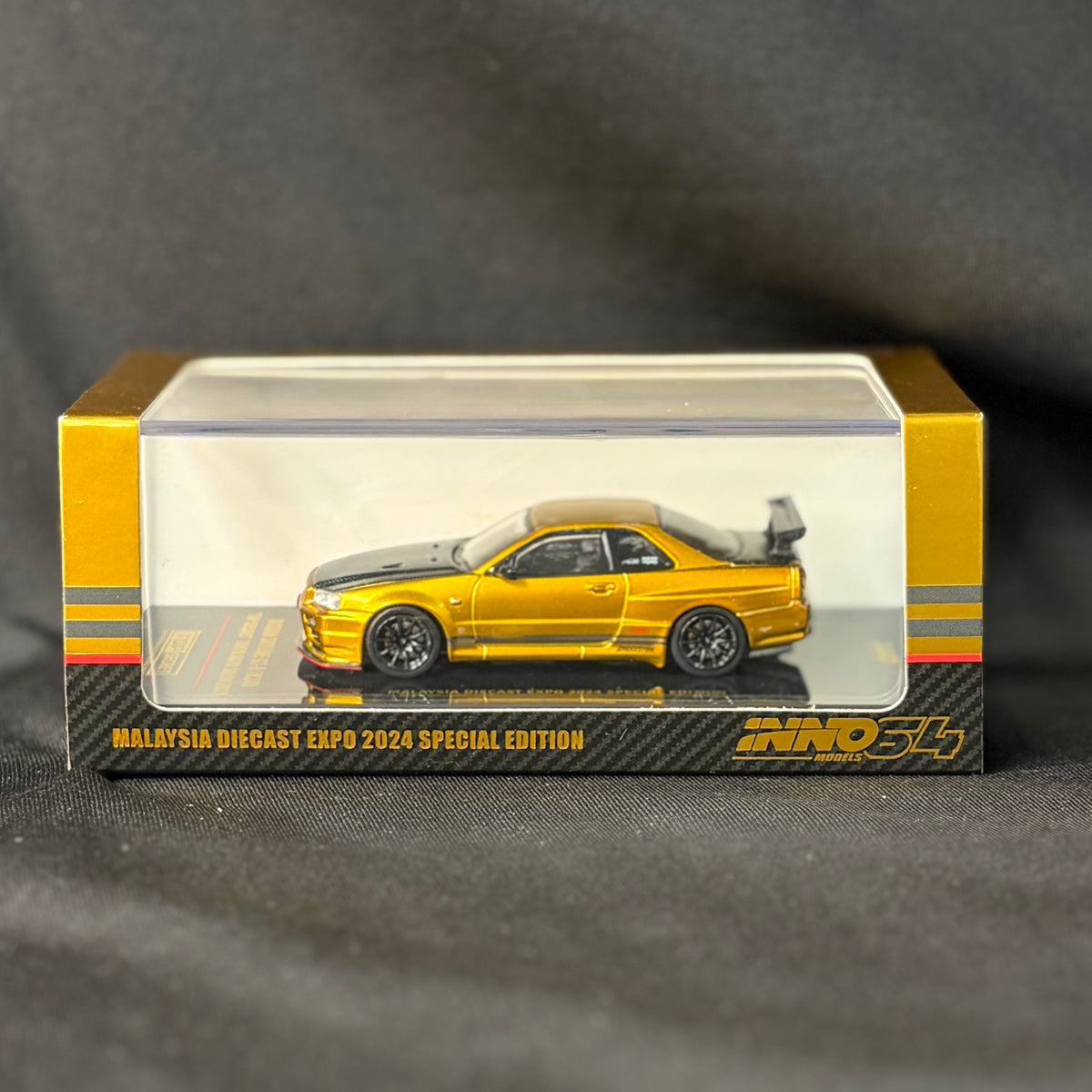 INNO64 Nissan Skyline GT-R R34 Top Secret Gold