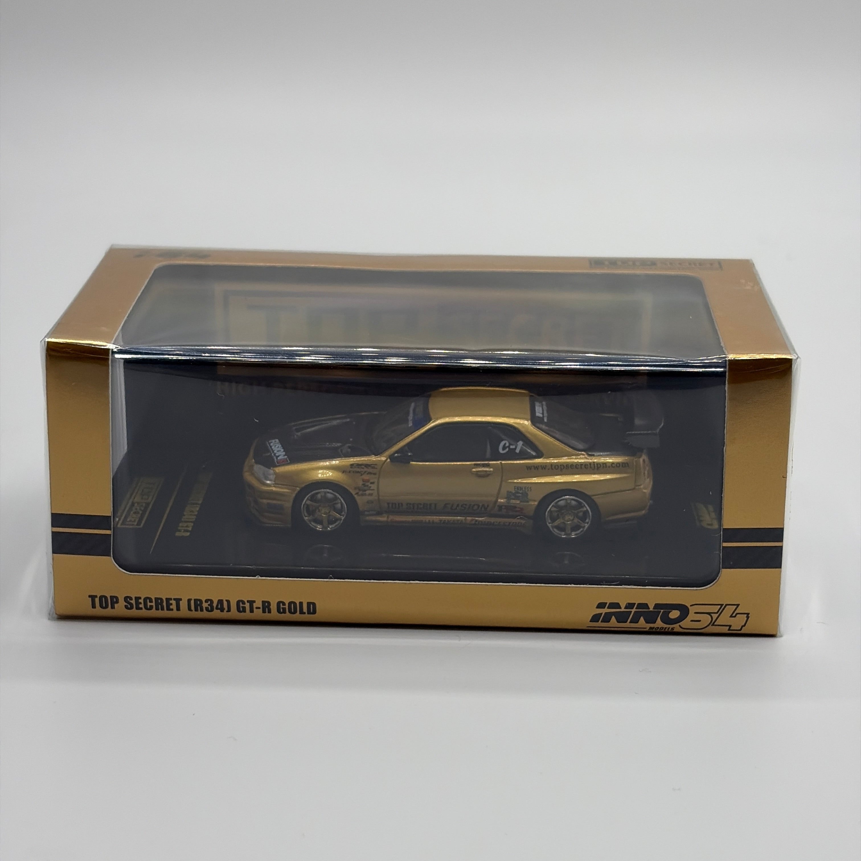 INNO64 Nissan Skyline GT-R R34 RHD Top Secret Gold