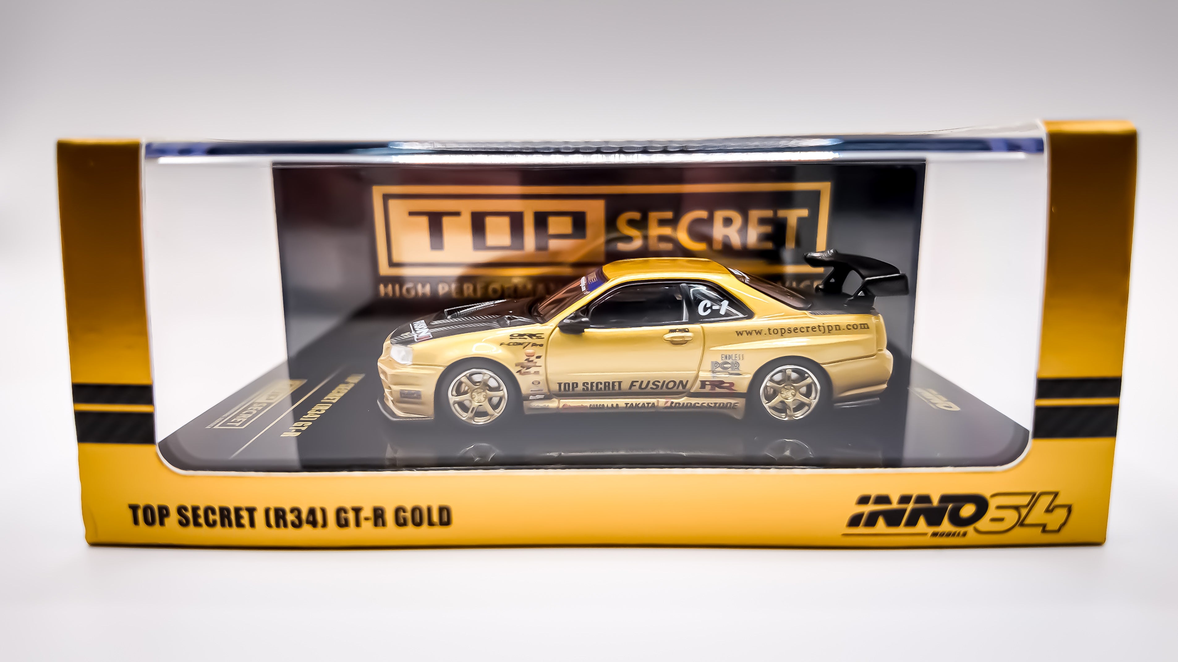 Top Secret Nissan Skyline GT-R R34 Gold Inno64 1/64 scale